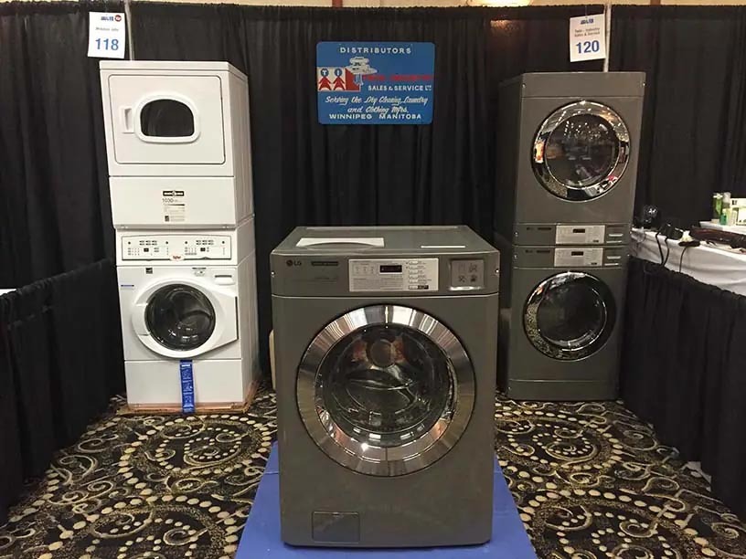A showcase area displaying stacking washers and dryers from LG and Unimac